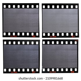 four different 35mm film strips with blank or empty frames on white background. vintage photo placeholder.