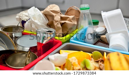 The four different container for sorting garbage. For plastic, paper, metal and organic waste