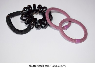 Four different hair bands on a gray background. - Shutterstock ID 2256512193