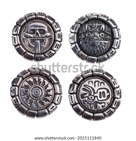 Four different medallions with a pattern on a white background