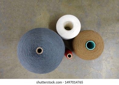 Four Different Spools of Thread Viewed from Above