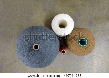Four Different Spools of Thread Viewed from Above