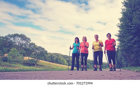 Four Elderly Women To Keep Fit And Healthy With Nordic Walking In Autumn