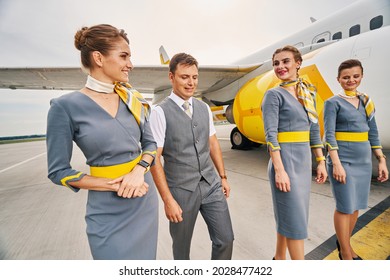 Four Elegant Aircrew Members At The Airdrome