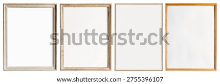 Four empty picture frames in various wood finishes are lined up against a white background, showcasing different styles and textures for home decor.
