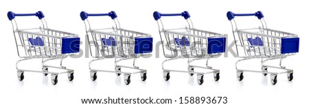 four empty shopping carts line, isolated over white