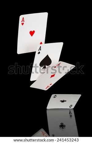 four falling aces isolated on black 