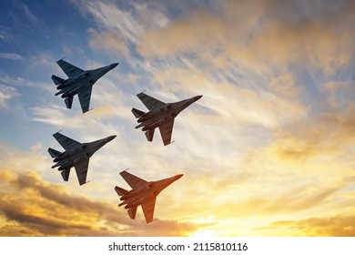 Four fighter jets in the shape of a diamond in the sky beautiful sunset