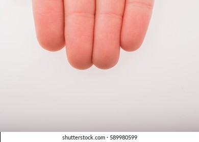 Four Fingers Of A Child Hand Partly Seen In View