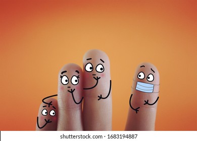 Four fingers are decorated as four person. One of them is wearing mask. Another three person are seeing him strangely.