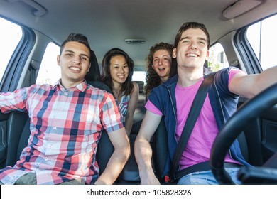 Four Friends In A Car Leaving For Vacation