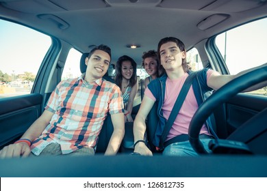 Four Friends In The Car Leaving For Vacation