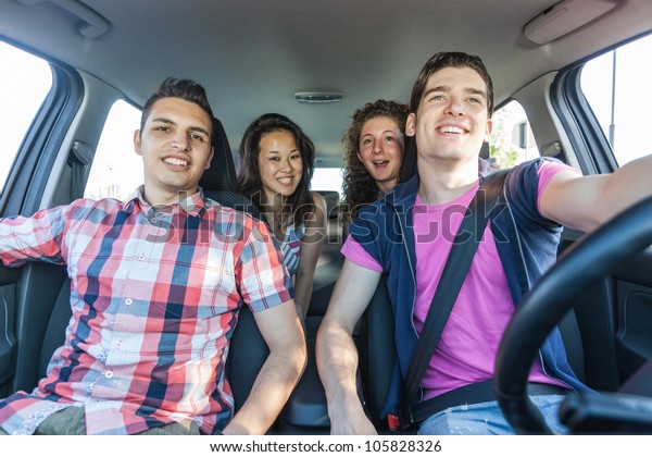 Four Friends in a\
Car Leaving For Vacation
