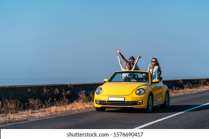 The Four Friends Have Fun In The Convertible Car