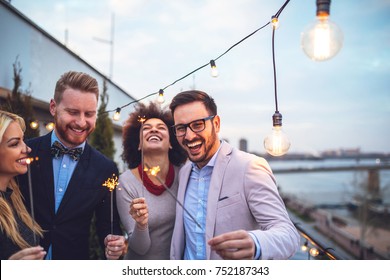 Four Friends Holding Sparklers