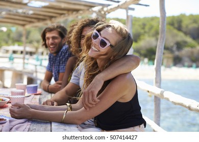 Four Friends Sitting In A Row At A Table By The Sea, Ibiza