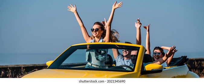 The Four Friends Travel In A Yellow Cabriolet