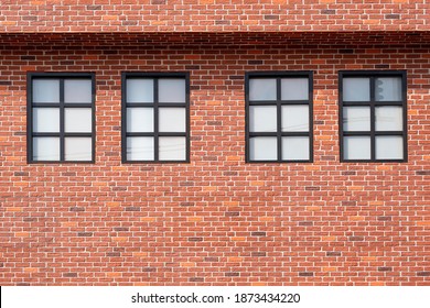 Four Frosted Glass Windows On Brick Wall Of 2 House Story In Vintage Style