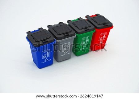 Four garbage classification bins on a white background