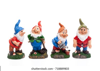 Four Garden Gnomes isolated on white background, simple figurines to decorate your garden