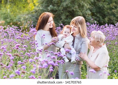 Four Generations Of Beautiful Women Standing In A Lavender Field