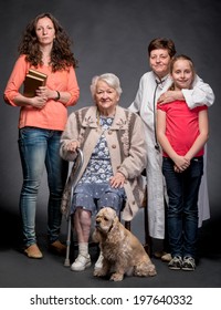 Four Generations Of Women On A Dark Background