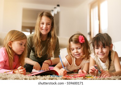 Four Girls Lying On Floor Write Stock Photo 559600171 