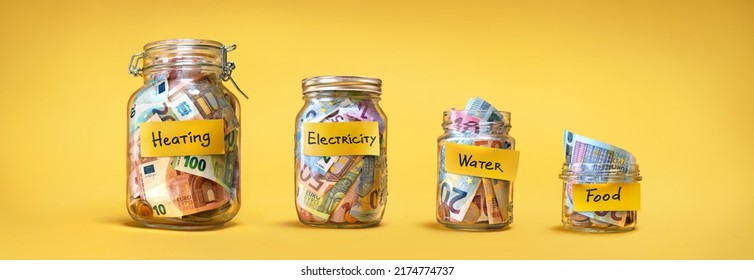 Four glass jars for savings, cash money (euro banknotes) on yellow background. For utility bills: heating, electricity, water. Savings for life and food - Shutterstock ID 2174774737