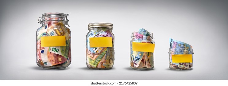 Four glass jars with yellow blank stickers, savings, cash money (euro banknotes) on grey background