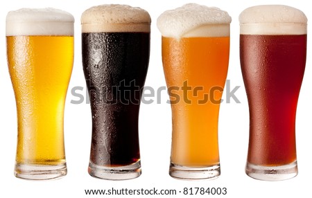 Four glasses with different beers on a white background. The file contains a path to cut.