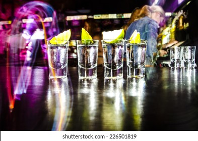 four glasses with Lim on the bar at a nightclub - Shutterstock ID 226501819