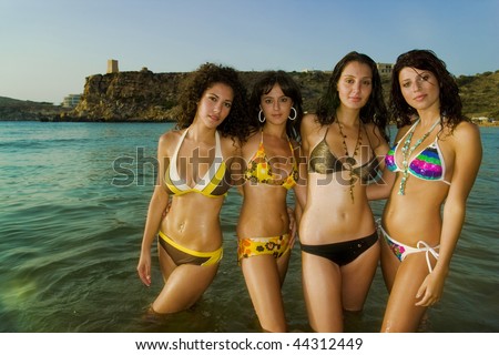 Four Gorgeous Young Girls Relaxing By The Ocean During A Hot Summers Day In Malta In Four Gorgeous Young Girls Relaxing By The Ocean During A Hot Summers Day In Malta In