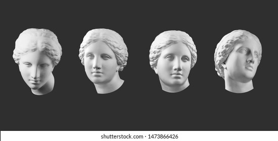 Four gypsum copy of ancient statue Venus head isolated on black background. Plaster sculpture woman face.
