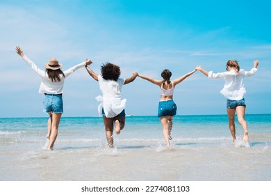 Four happy friends at sunset beach party runs to water, Silhouette group of teens holding hands and running together at the sunset sea, friendship and teamwork concept. - Powered by Shutterstock