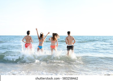 Group Friends Run Sea Concept Summertime Stock Photo (Edit Now) 691207387