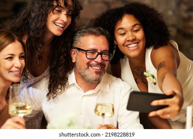 Four Happy Intercultural Well-dressed People Gathered For Wedding Party Taking Selfie Or Communicating With Friends In Video Chat