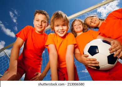 Four Happy Kids With Football Portrait