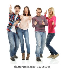Four Happy Young People Showing Thumbs Up On White Background