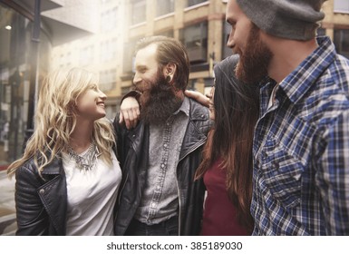 Four Hipsters Meeting In The City Centre