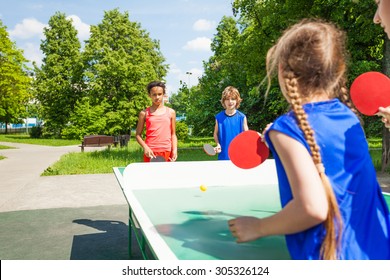 Four International Friends Play Table Tennis