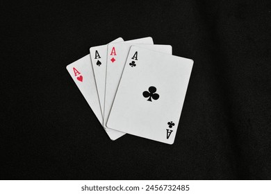 four of a kind aces , poker Card game , Ace of Diamonds, Ace of Clubs, Ace of Hearts, Ace of Spades isolated on black background