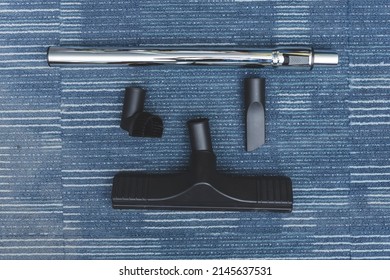 Four Kind Of Attachments For A Vacuum Cleaner - An Extension Wand, Floor Sweeper, Crevice Tool, And Dusting Brush.