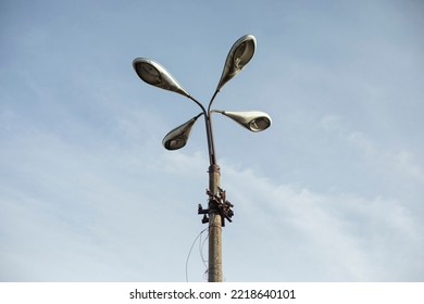 Four Lamps On Pole. Lighting Fixture Of Old Type. Old Light Pole.