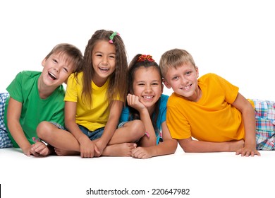 Four Laughing Children Are Lying On The White Background