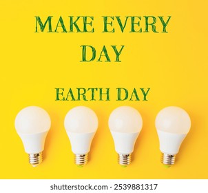 Four light bulbs on a yellow background with the words Make Every Day Earth Day. Concept of promoting environmental awareness - Powered by Shutterstock