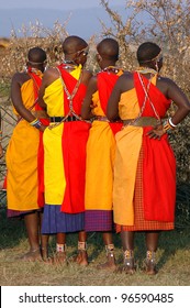 Four Masai Mara Women Preparing To Dance