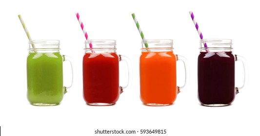 Four Mason Jar Glasses Of Vegetable Juice, Greens, Tomato, Carrot And Beet, Isolated On A White Background