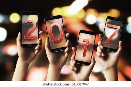 Four men mobile smartphone screen number. Celebrate the New Year 2017