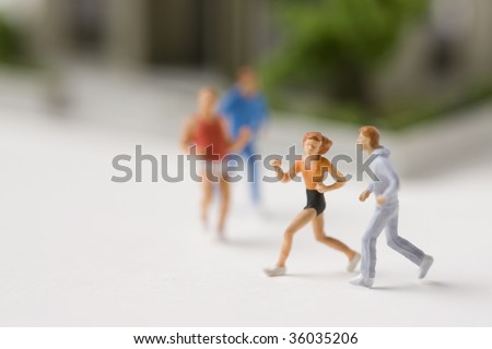 Four models of people jogging on the street