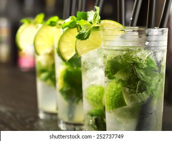 Four Mojito Cocktails On A Bar Counter